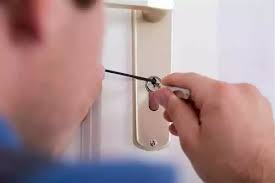 Locksmith opening a locked door without damage